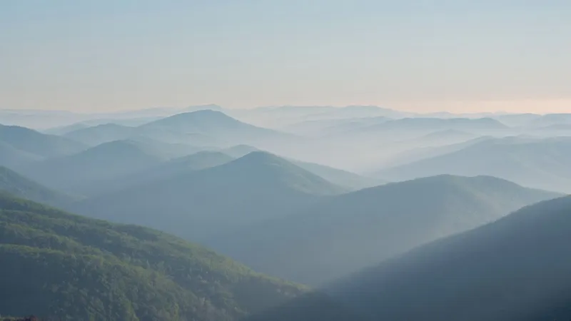 Hazy blue ridgelines of the Smoky Mountains receding into morning light